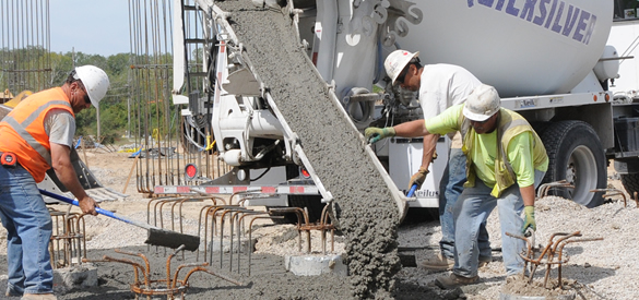 Men pouring concrete